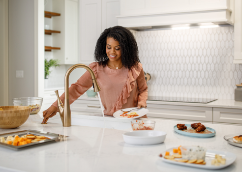 Woman Enjoying Clean Kitchen