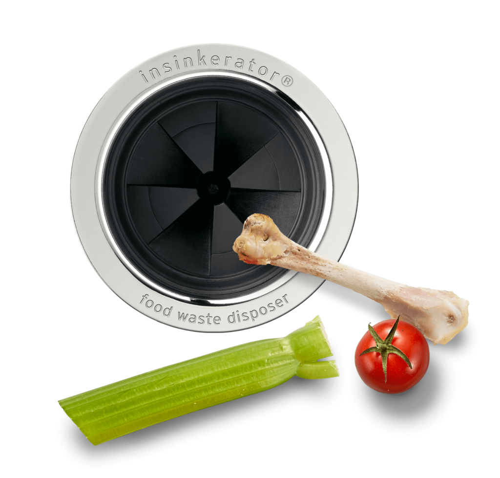 InSinkErator Baffle with a chicken bone, celery, and a tomato